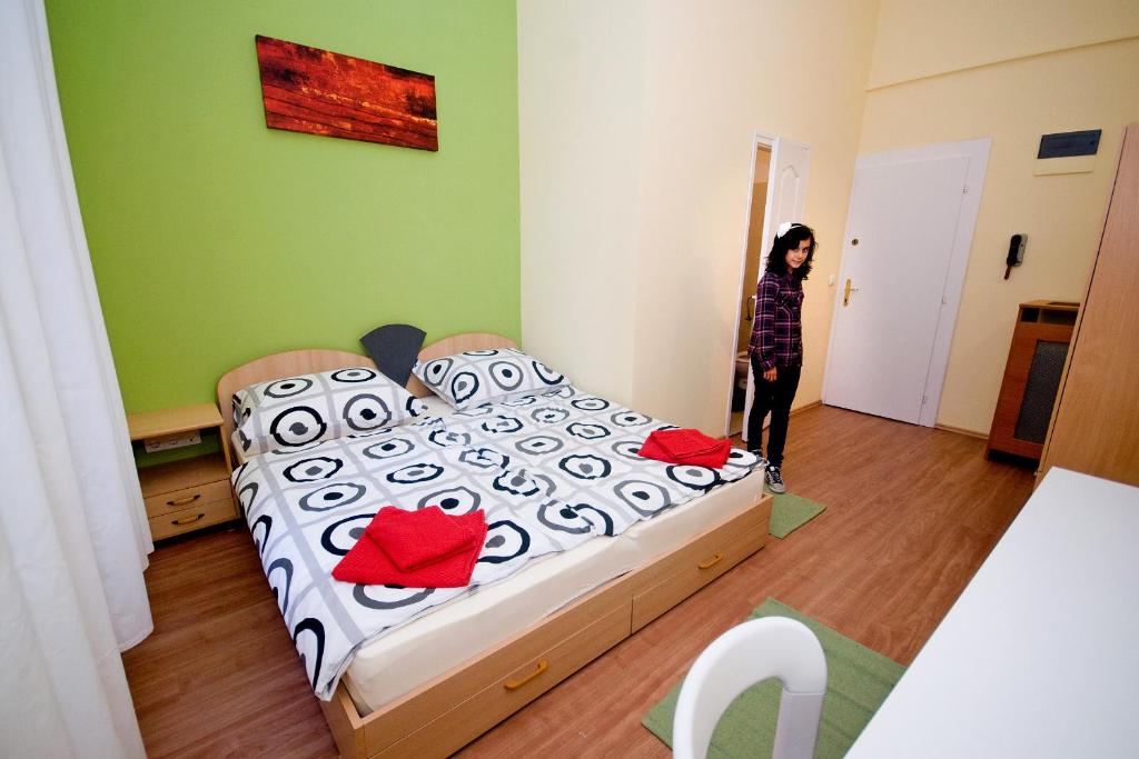 Postel nebo postele na pokoji v ubytování CentrÁlom Apartman