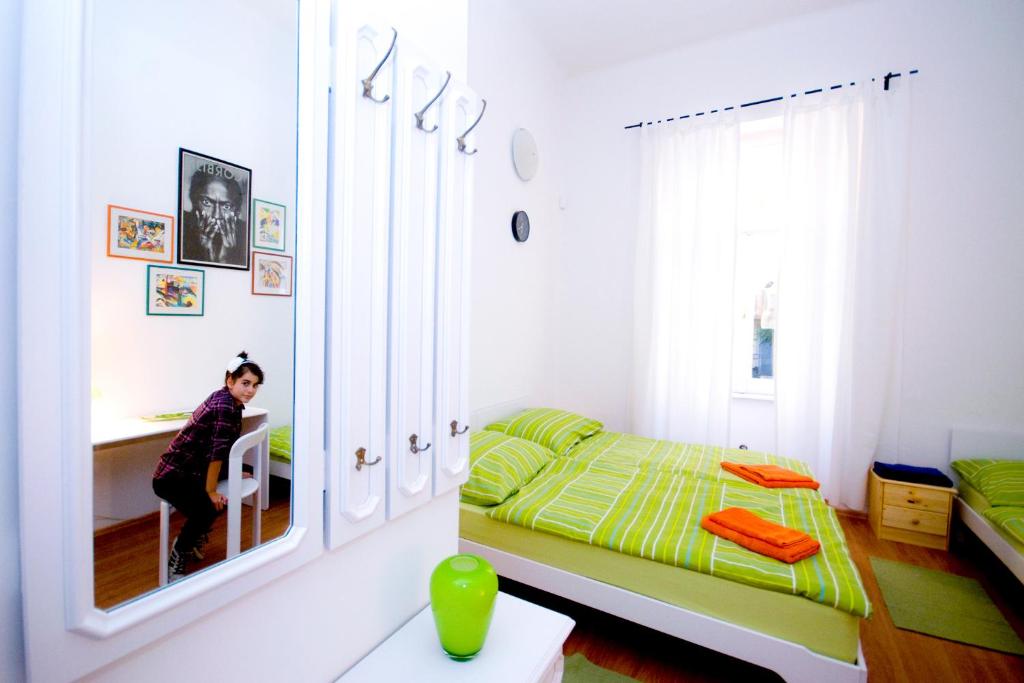 Postel nebo postele na pokoji v ubytování CentrÁlom Apartman