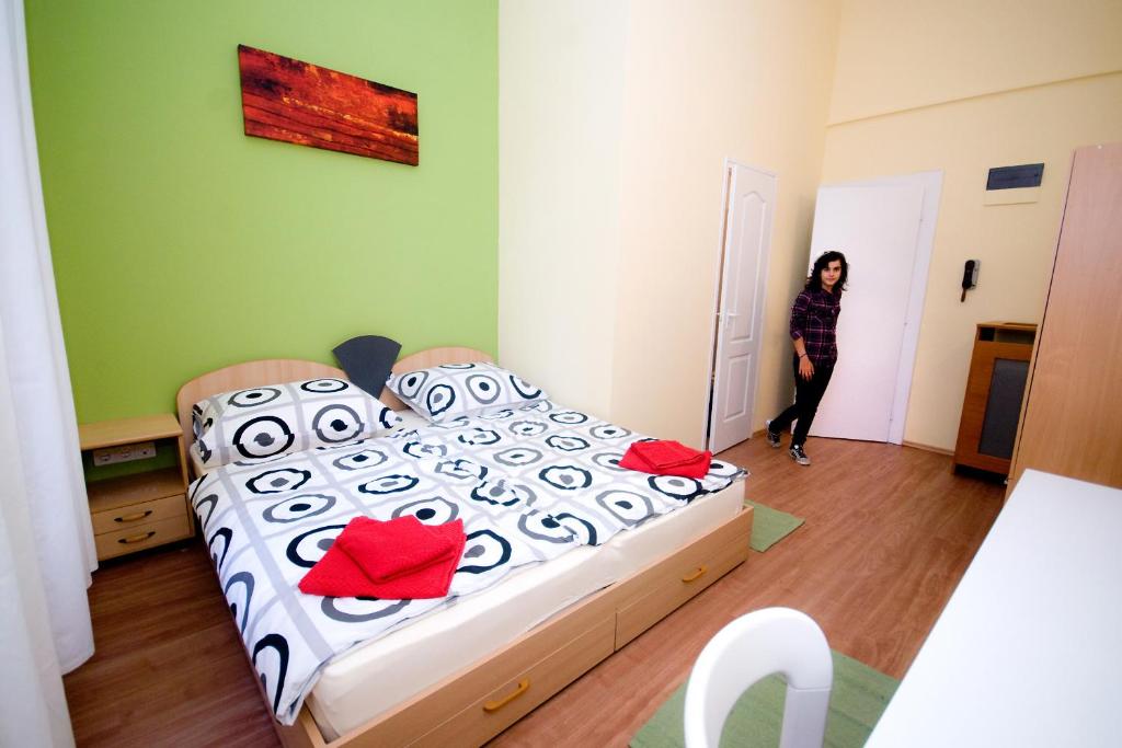 Postel nebo postele na pokoji v ubytování CentrÁlom Apartman