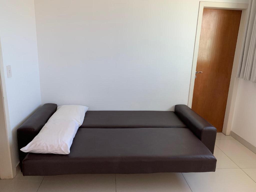 Säng eller sängar i ett rum på Cobertura Duplex em Condomínio de Alto Luxo - 402