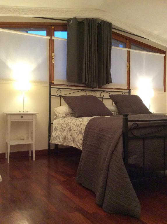Posteľ alebo postele v izbe v ubytovaní Apartment La Mansarda