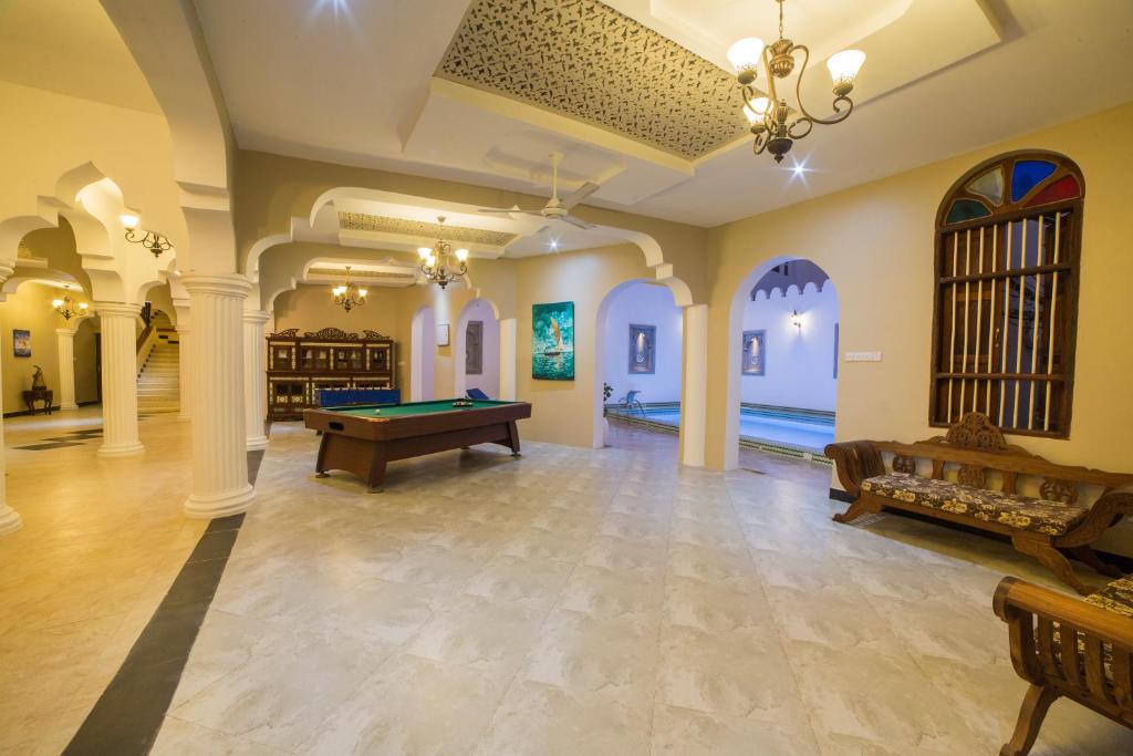 a large room with a pool table in it at Tembo House Hotel in Zanzibar City