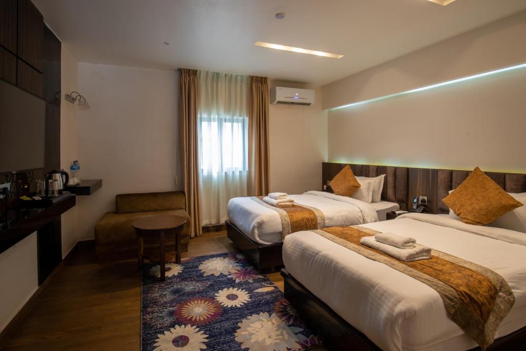 Voodi või voodid majutusasutuse Nansc Hotel toas