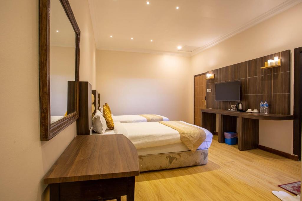 Voodi või voodid majutusasutuse Nansc Hotel toas