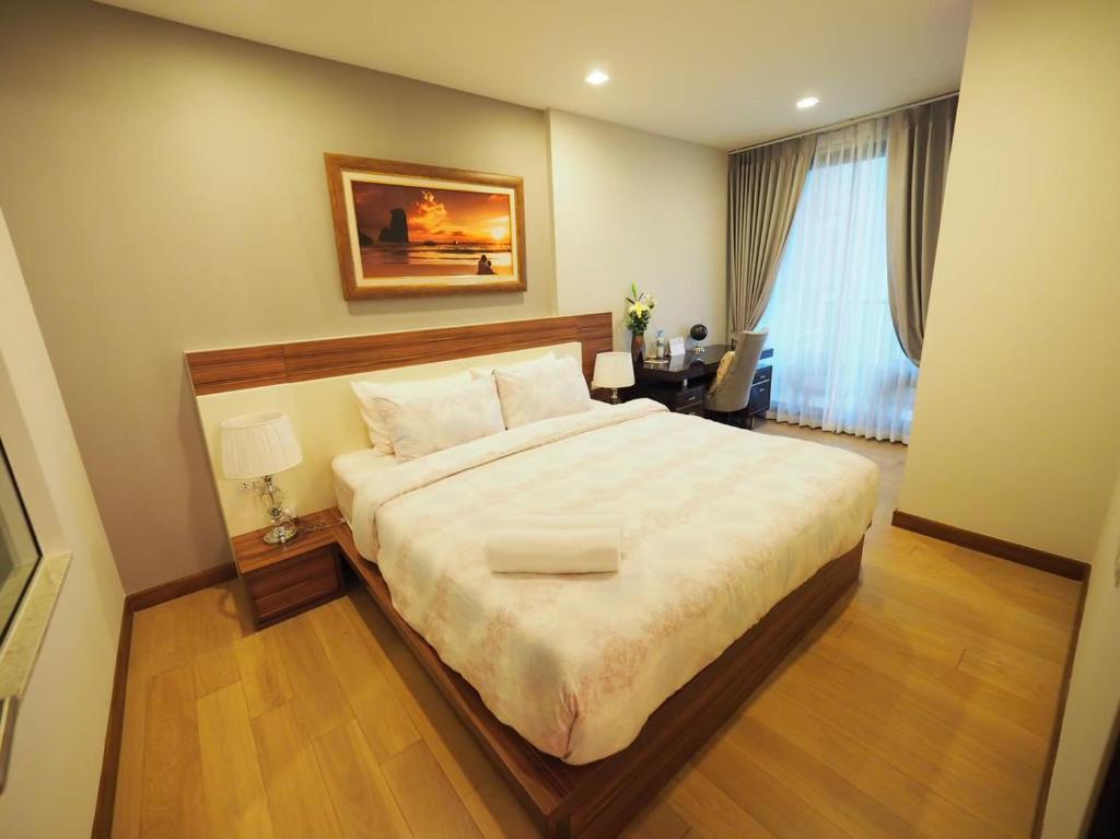 Postel nebo postele na pokoji v ubytování Chiang Mai Cozy Living #707