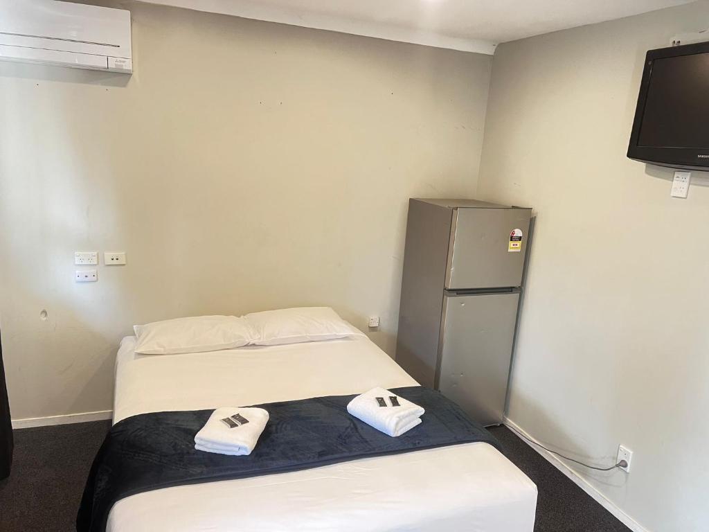 Postel nebo postele na pokoji v ubytování Dash Motel, Papakura
