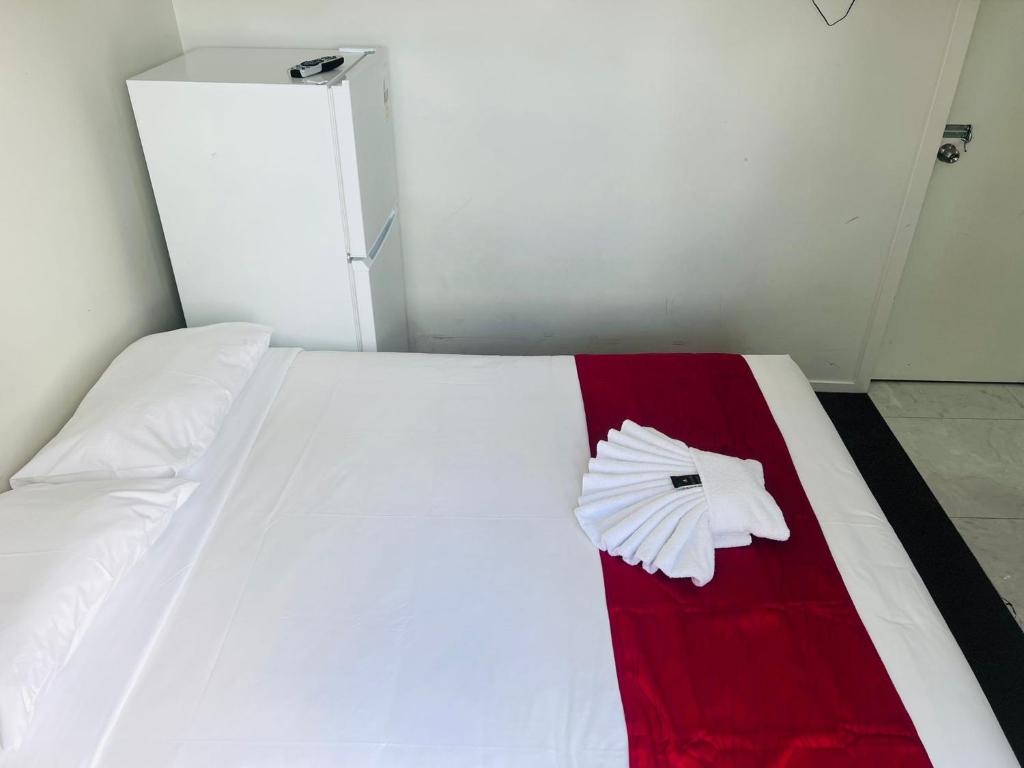 Postel nebo postele na pokoji v ubytování Dash Motel, Papakura