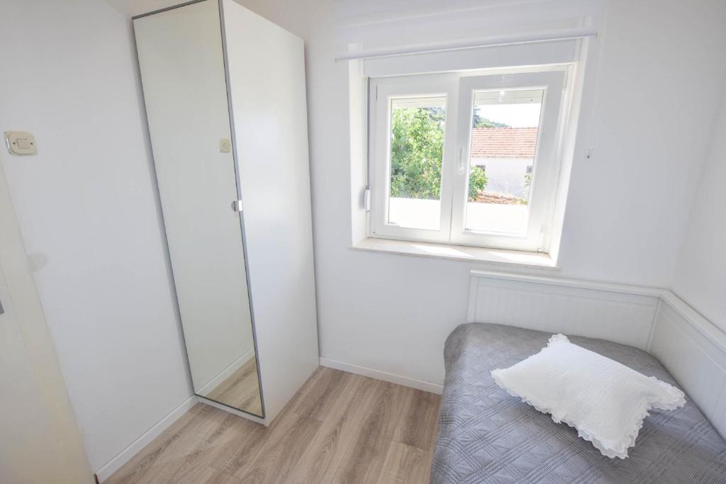 Łóżko lub łóżka w pokoju w obiekcie Apartment S and E