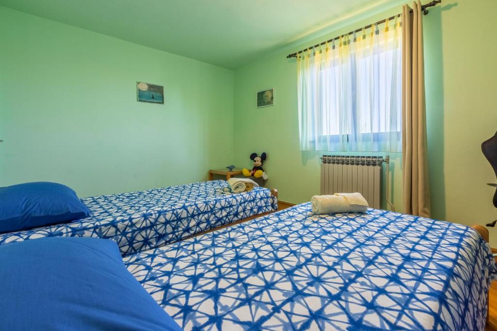 Posteľ alebo postele v izbe v ubytovaní House Forest Paradise