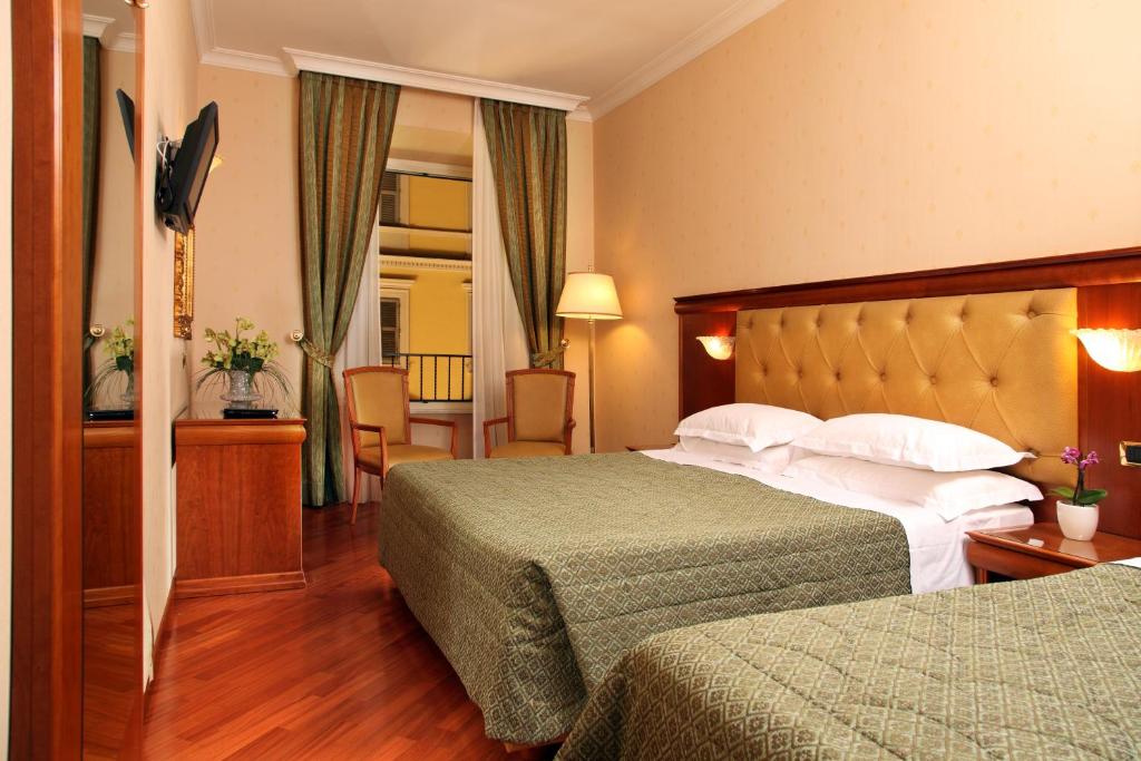 Postel nebo postele na pokoji v ubytování Hotel Serena srl