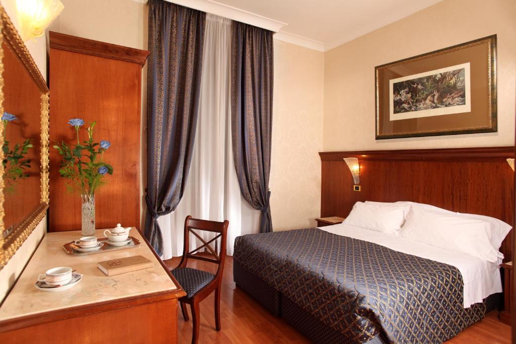 Postel nebo postele na pokoji v ubytování Hotel Serena srl