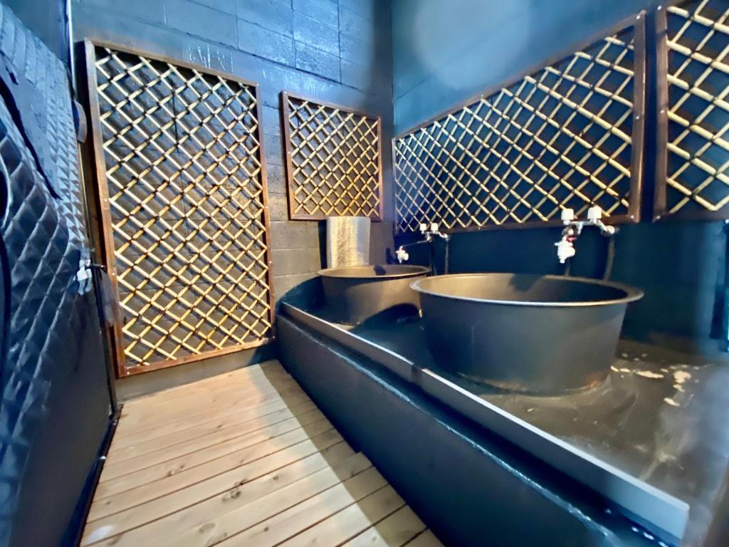 two sinks in a bathroom with blue walls at 貸切御宿Villa EL 5 Nikko Kinugawa Area in Nikko