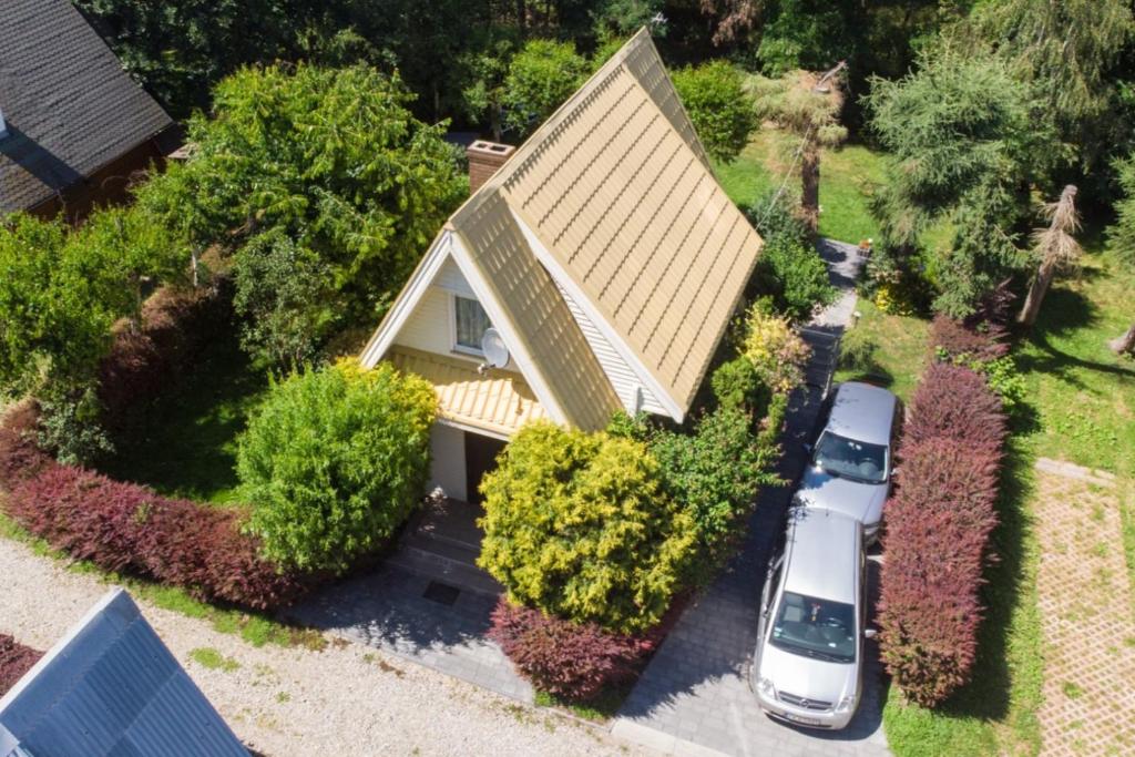 an aerial view of a house with a car parked in front at Domek Letniskowy Głebinów in Nysa
