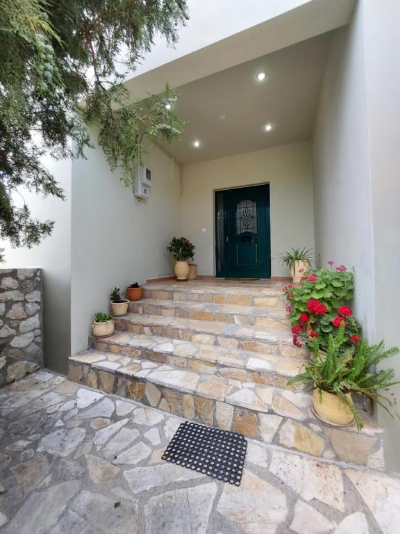 a stone walkway leading to the front door of a house at Villa Varvara 
