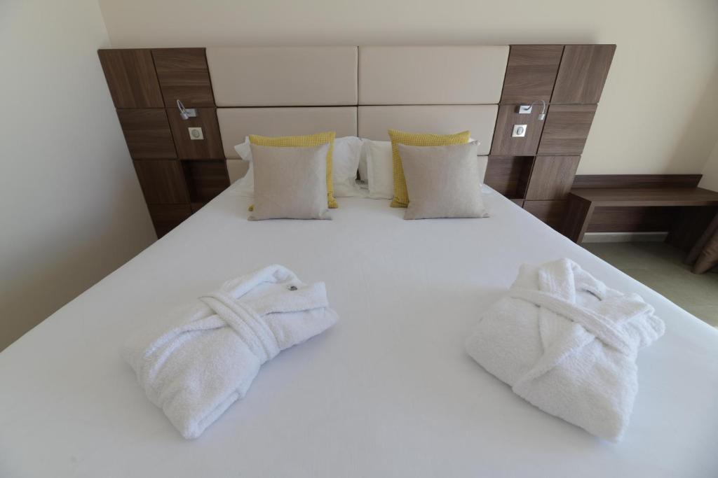 Postel nebo postele na pokoji v ubytování Hotel Port Toga