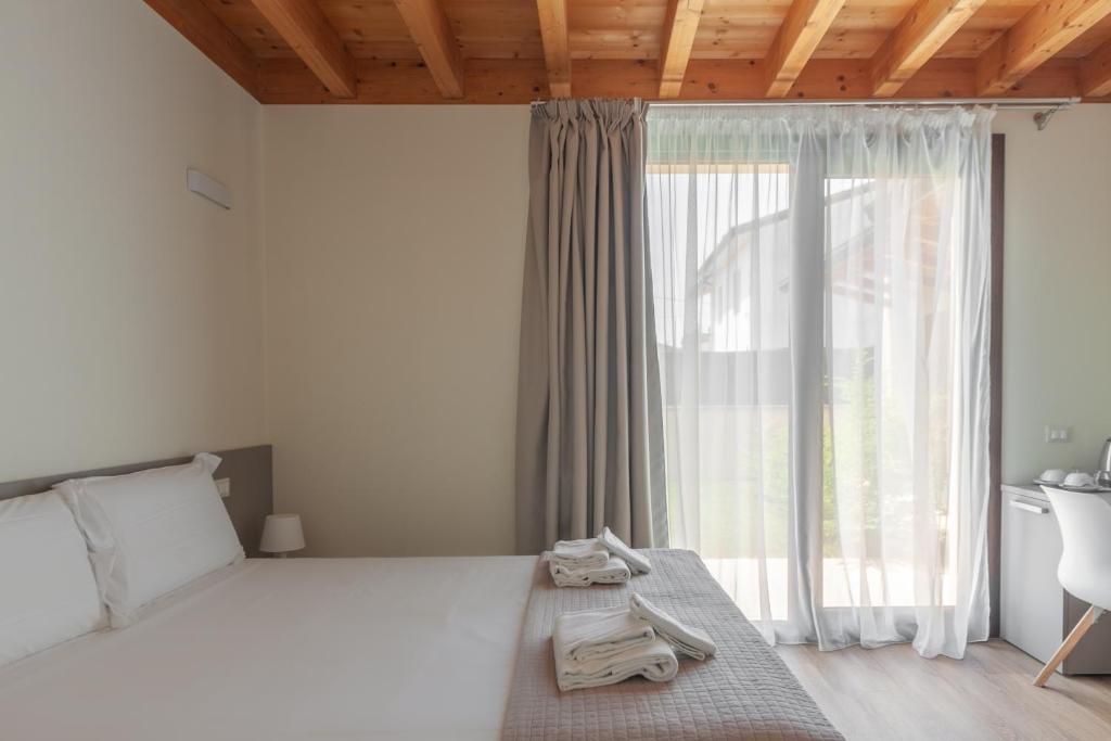 Postel nebo postele na pokoji v ubytování Garda Relais