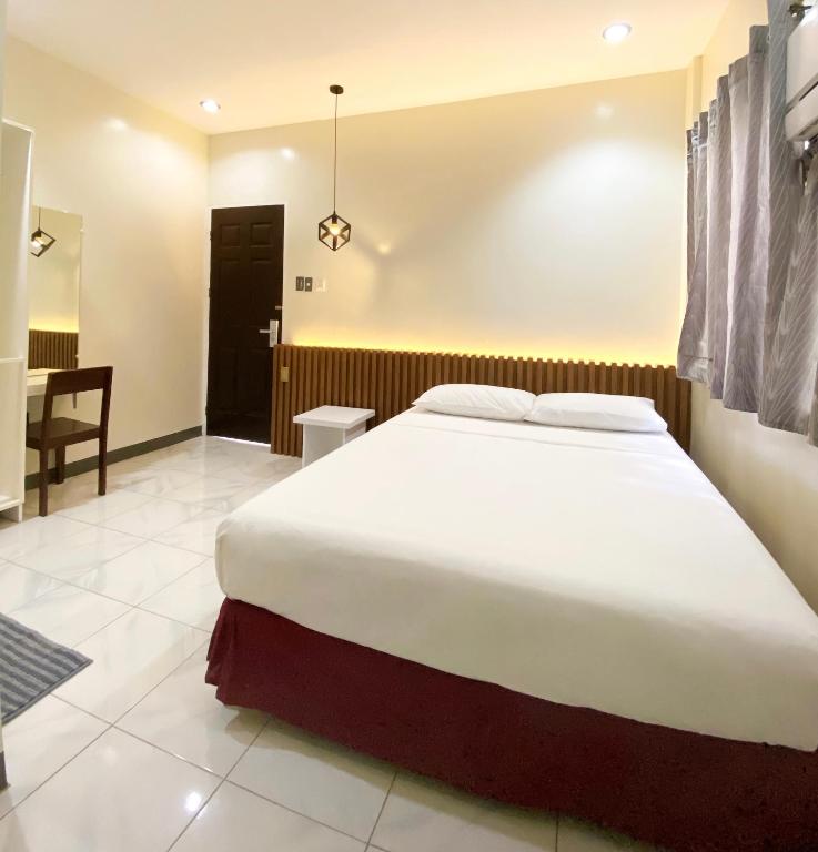 Postel nebo postele na pokoji v ubytování Ariano's Inn