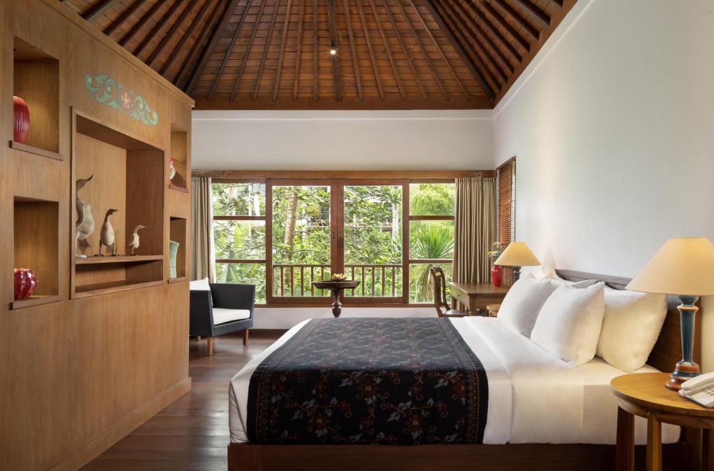 Postel nebo postele na pokoji v ubytování Korurua Dijiwa Ubud