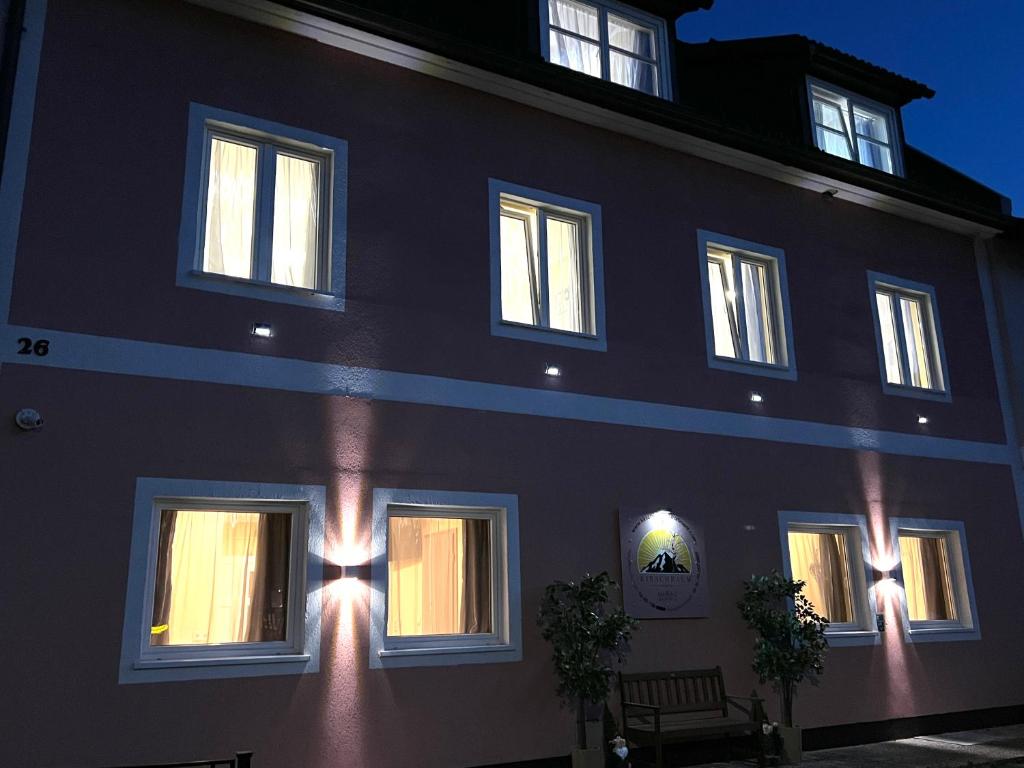 a black building with lights on the side of it at Kirschbaum Apartment in Murau