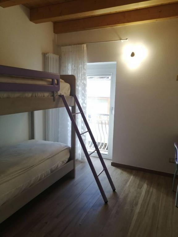 Postel nebo postele na pokoji v ubytování Cadore Luminoso appartamento