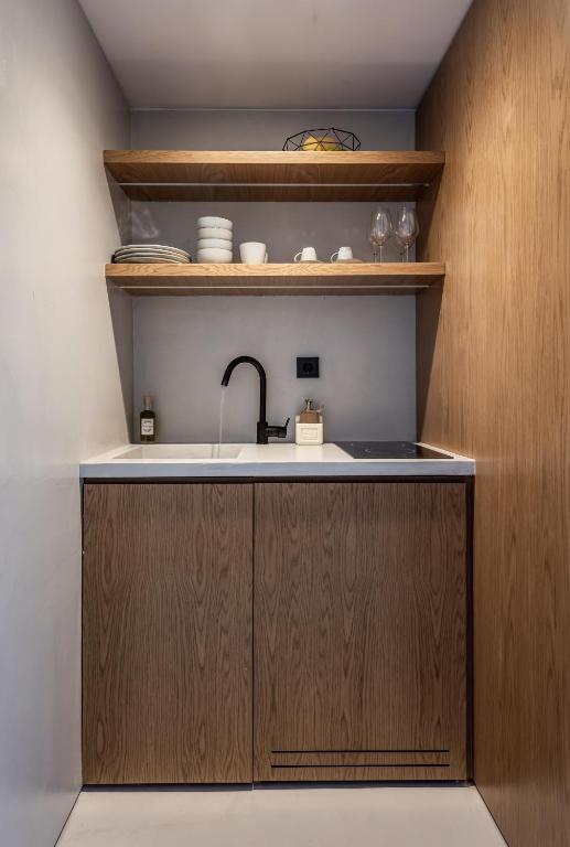 Kuchyň nebo kuchyňský kout v ubytování Ariadne Suites