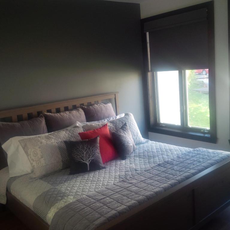 Postel nebo postele na pokoji v ubytování Les Chalets Sauvignon