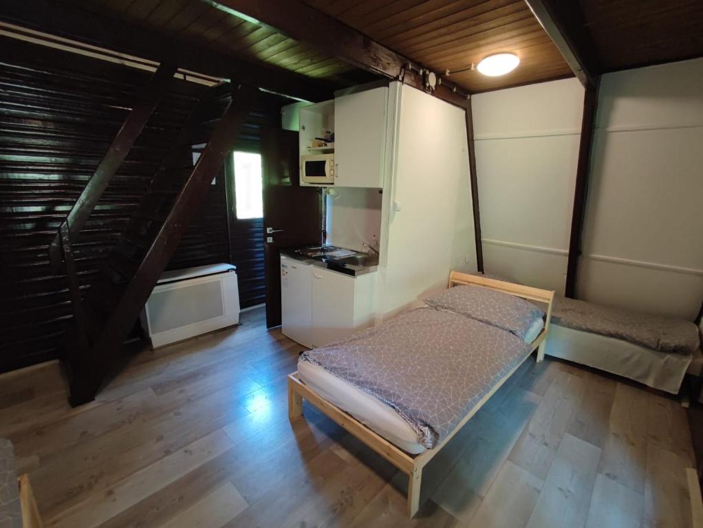 Posteľ alebo postele v izbe v ubytovaní Mátrai Vándor Apartmanok