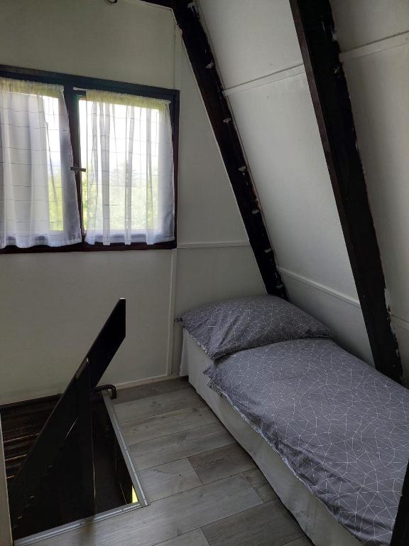 Posteľ alebo postele v izbe v ubytovaní Mátrai Vándor Apartmanok