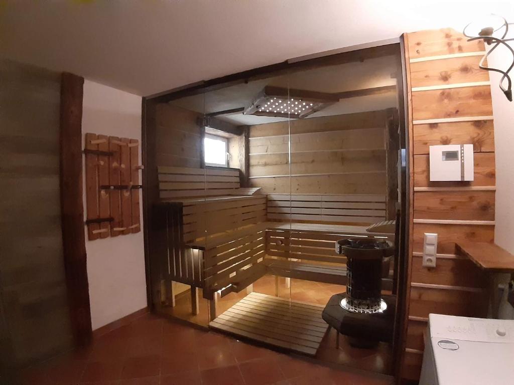 a room with a sauna in a house at Schönberghütte in Lachtal