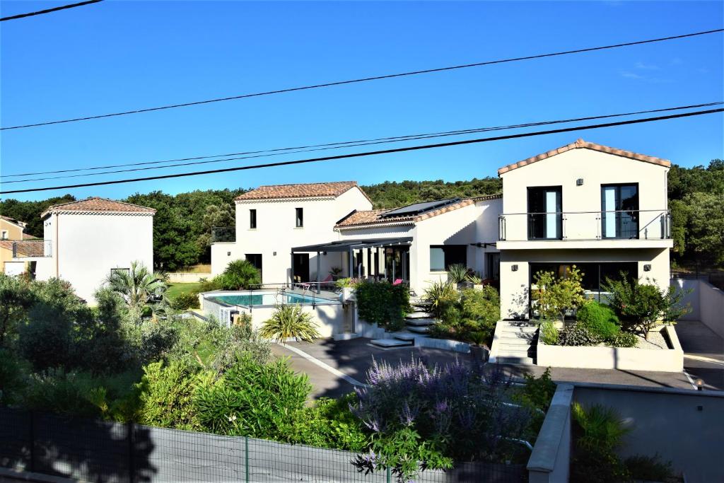 a villa with a view of a house at Gite de Garance in Montségur-sur-Lauzon