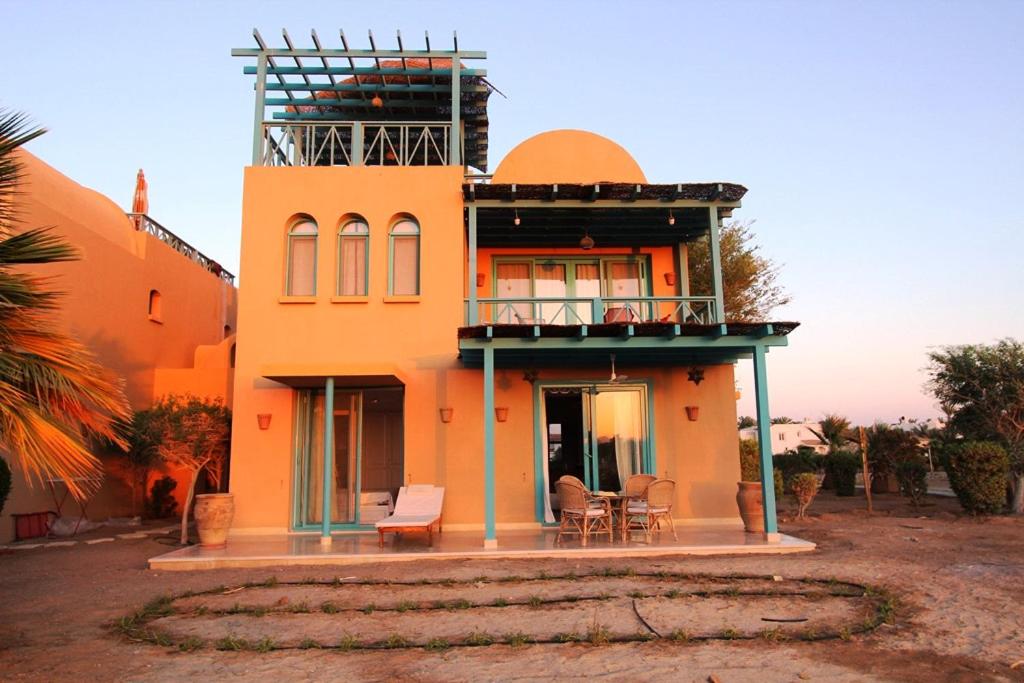 a house with a tower on top of it at El Gouna spacious flat in Steigenberger Golf in Hurghada