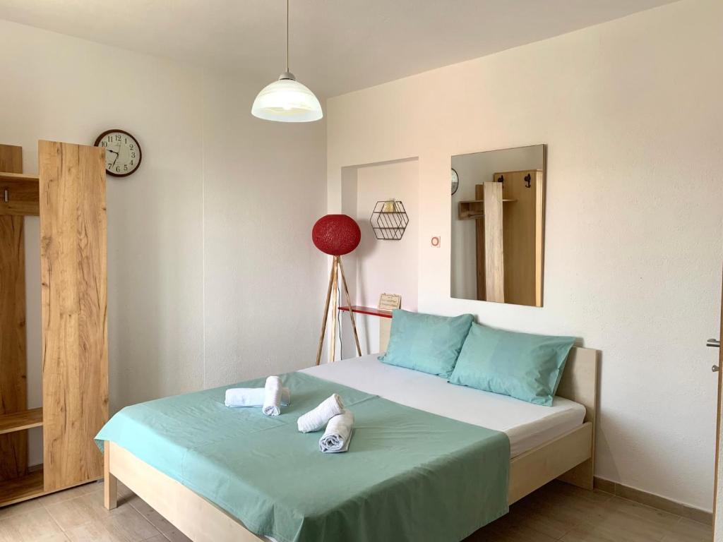 Postel nebo postele na pokoji v ubytování Apartman DMA