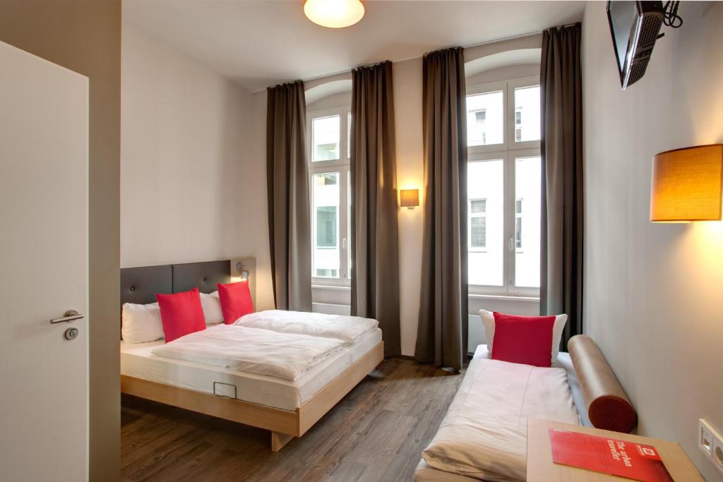 Postel nebo postele na pokoji v ubytování MEININGER Hotel Berlin Mitte
