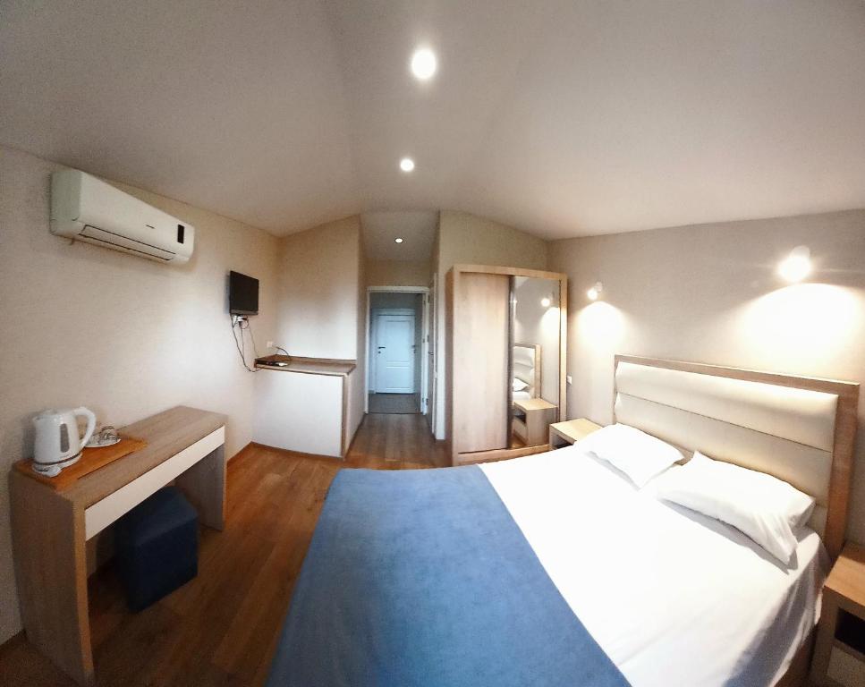 Postel nebo postele na pokoji v ubytování Hotel Lile