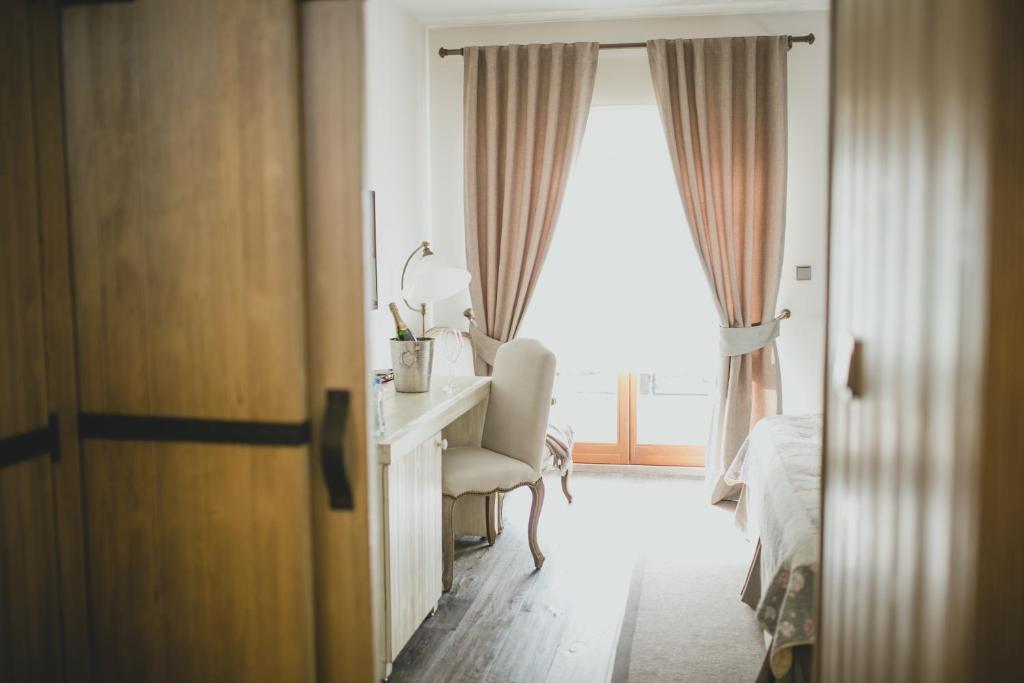 Tempat tidur dalam kamar di Resort Čapí Hnízdo
