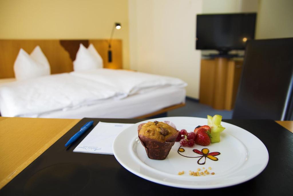 Postel nebo postele na pokoji v ubytování Atlanta Hotel Leipzig