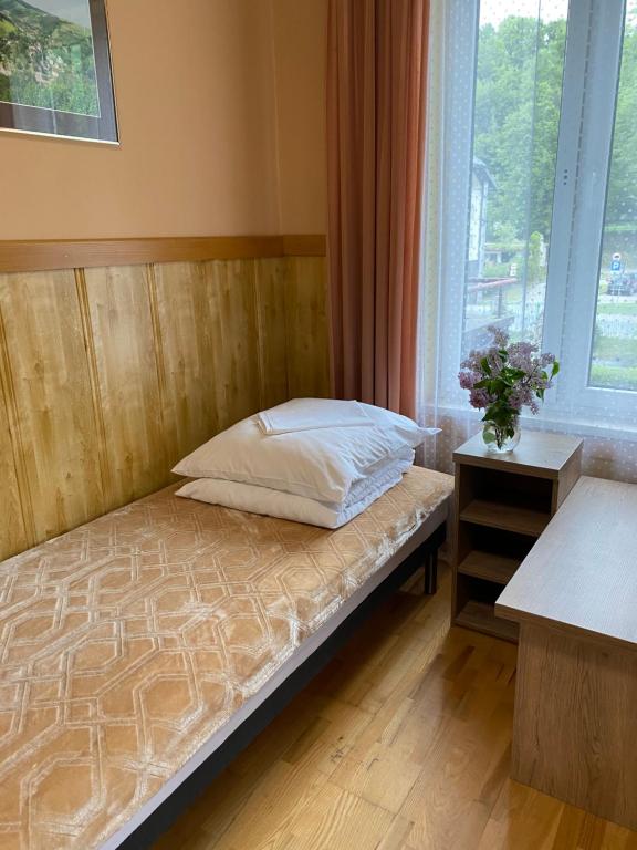 Ένα ή περισσότερα κρεβάτια σε δωμάτιο στο Dom Wypoczynkowy Relaks