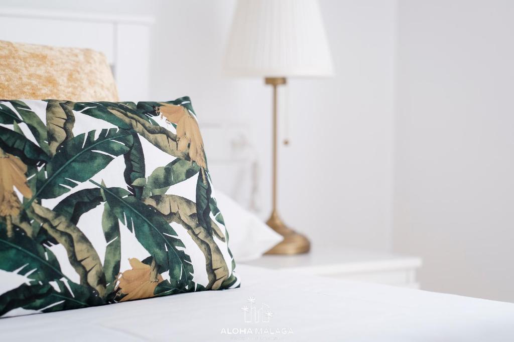 A bed or beds in a room at Wonderful Malaga Centro Apartment