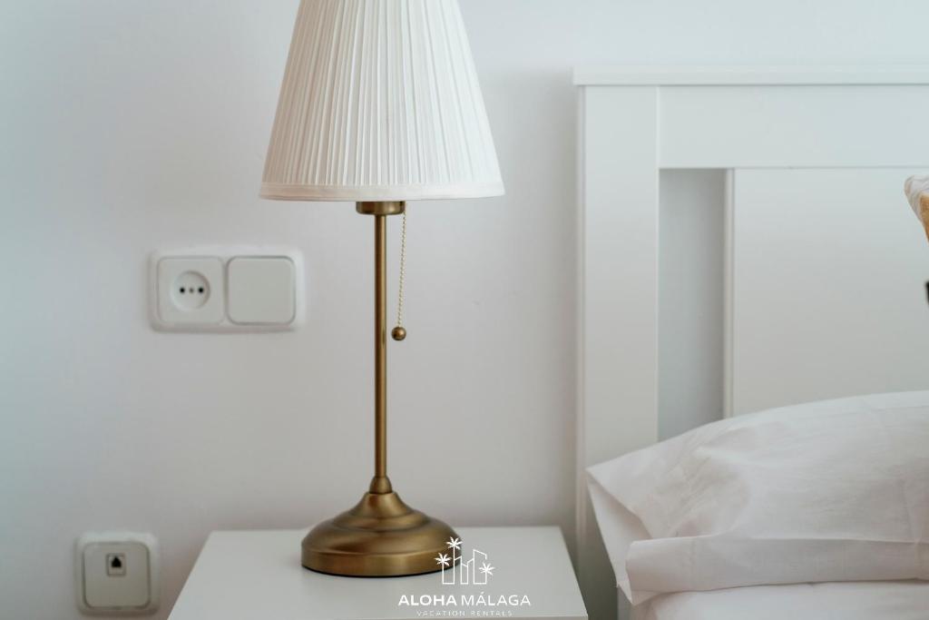 A bed or beds in a room at Wonderful Malaga Centro Apartment