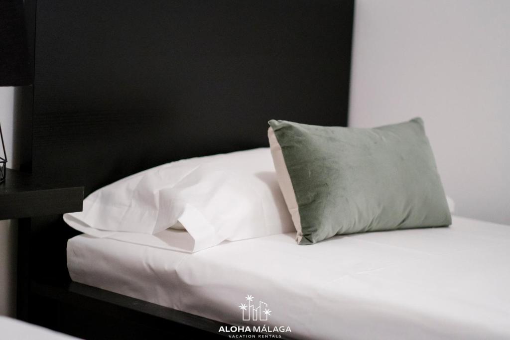 A bed or beds in a room at Wonderful Malaga Centro Apartment