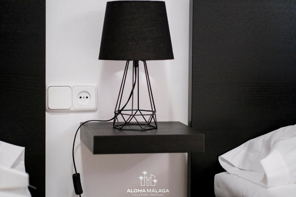 A bed or beds in a room at Wonderful Malaga Centro Apartment