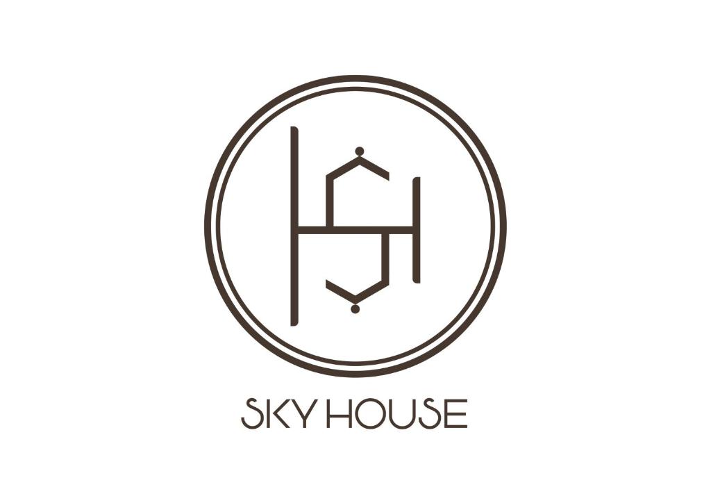 a logo for aomy house in a circle at Sky House Hostel in Ho Chi Minh City