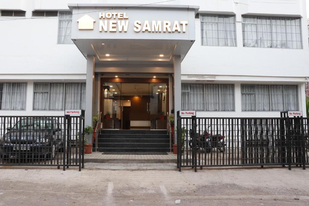 a hotel with a new summit sign on the front of it at Hotel New Samrat in Aurangabad
