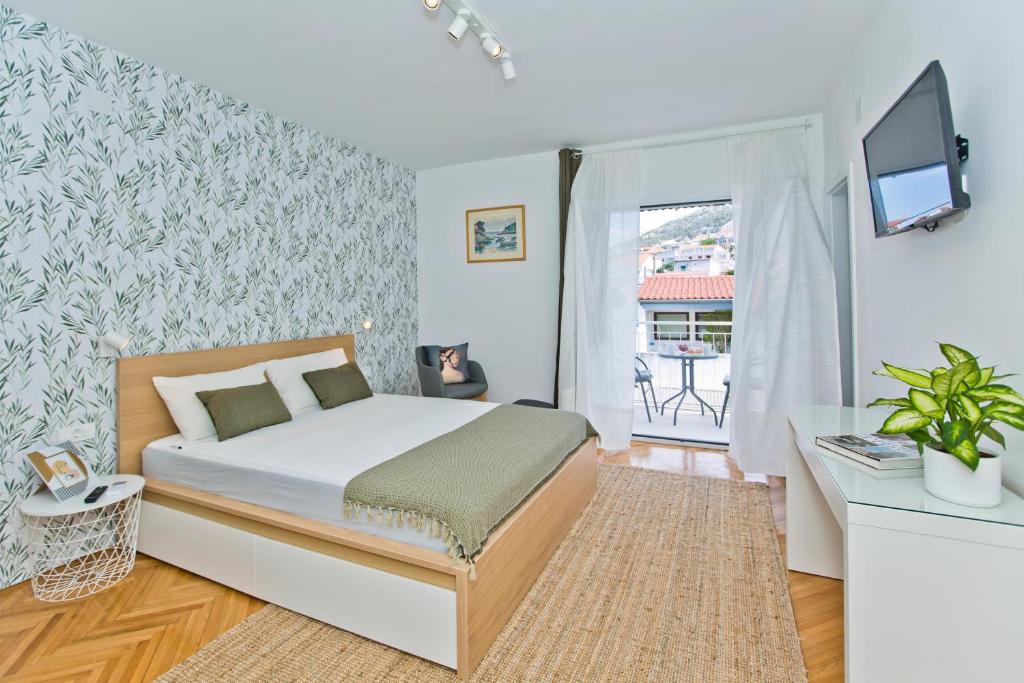 Postel nebo postele na pokoji v ubytování Hvar Deluxe Rooms
