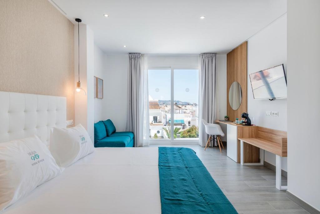 Postel nebo postele na pokoji v ubytování Nerja VG Hostal Boutique