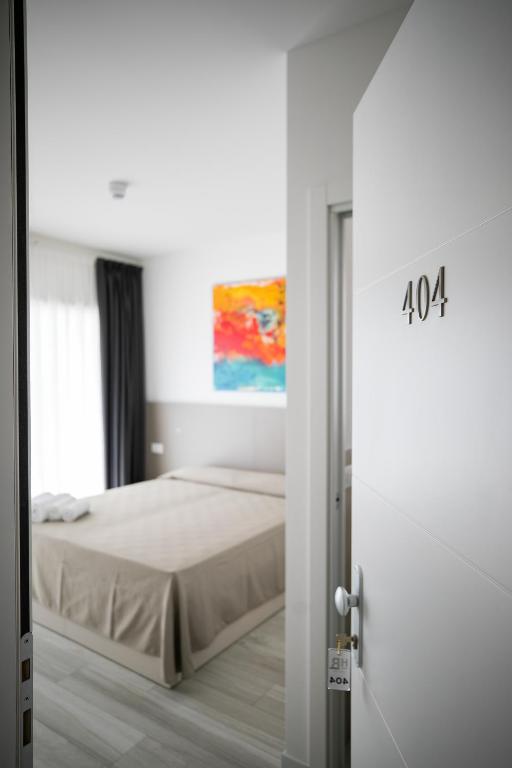 Postel nebo postele na pokoji v ubytování Hotel Boston 3 Stelle Superior Frontemare