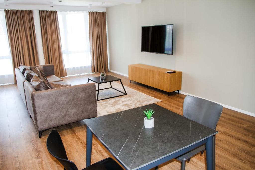 TV a/nebo společenská místnost v ubytování Swiss Apartments Prishtina