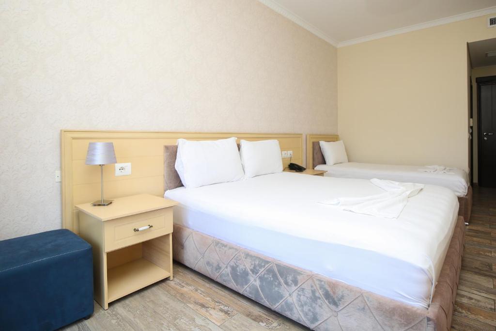 Postel nebo postele na pokoji v ubytování Hotel Summer Stars