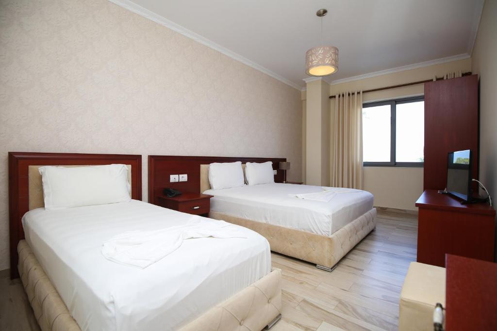 Postel nebo postele na pokoji v ubytování Hotel Summer Stars