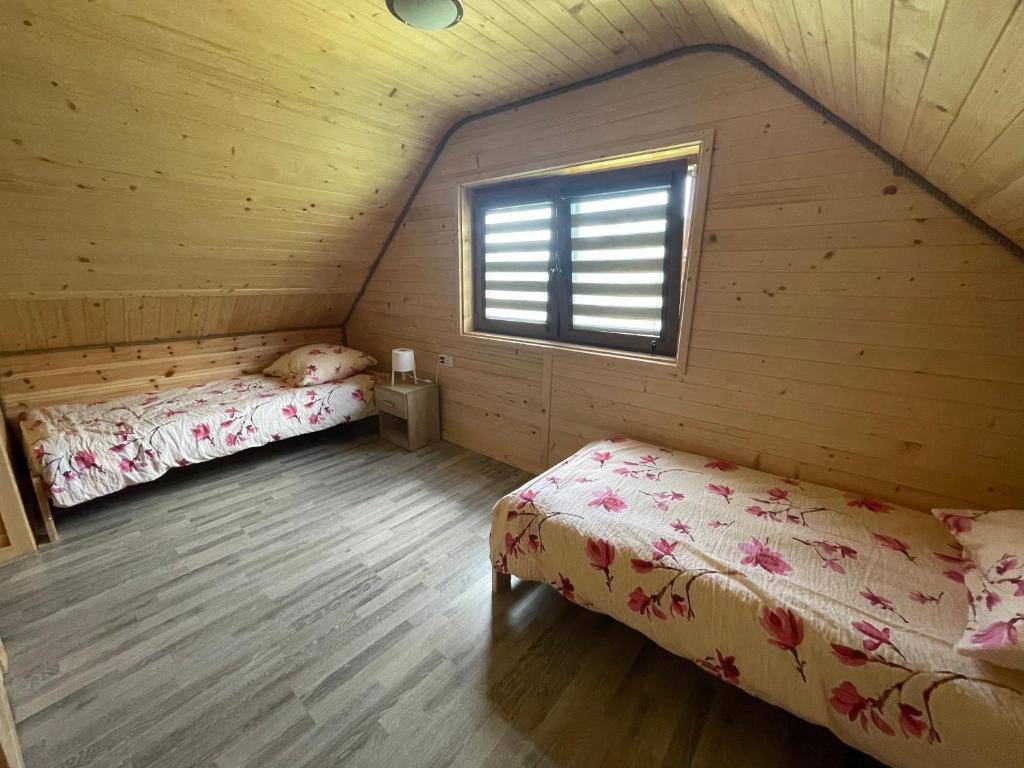 Postel nebo postele na pokoji v ubytování Uweronci